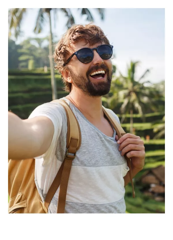 Young man selfie at Tegalalang Rice Terrace after extend his visa with Bali Visa Center